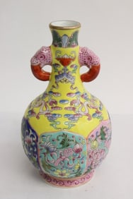 A yellow background famille rose vase