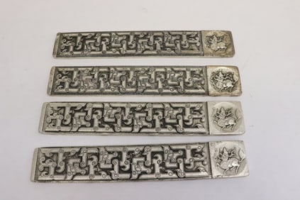 4 white metal scroll weights
