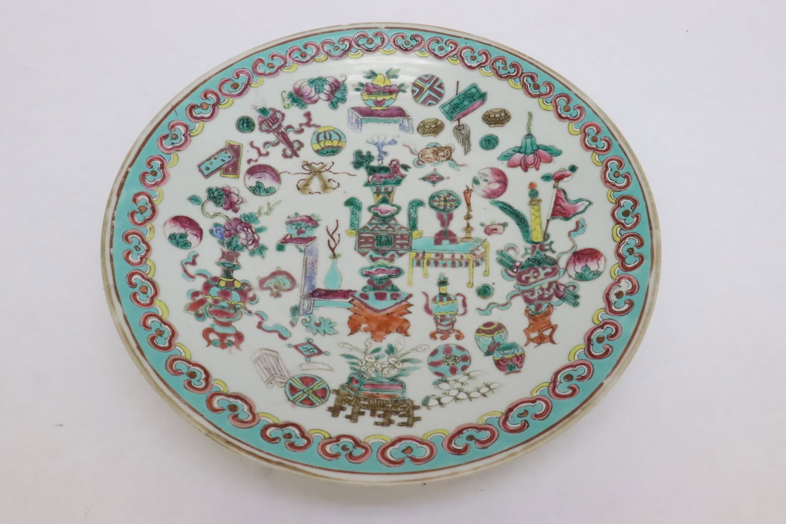 A vintage Chinese famille rose porcelain plate: A vintage Chinese famille rose porcelain plate, edge minor chip, 2.05"x11.6"dia
