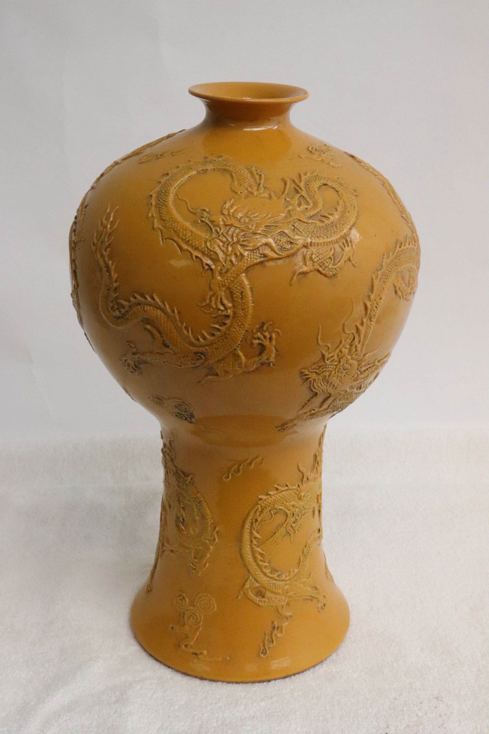 Yellow porcelain meiping: Yellow porcelain meiping with dragon motif decoration in relief, 10.6"x6.3"dia