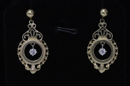 Pair 14K Y/G diamond earrings