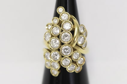 A large free form 14K Y/G diamond ring