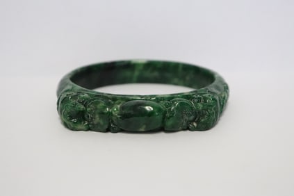 A natural emerald green jadeite bangle w/ GIA certificate