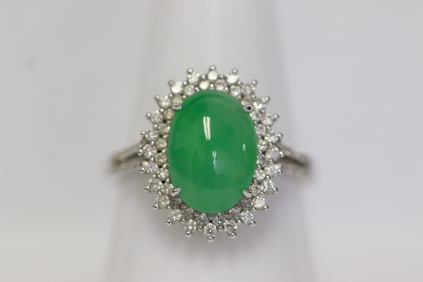 An 18K W/G jadeite diamond ring