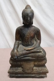 A plaster sculpture of Buddha, repair
