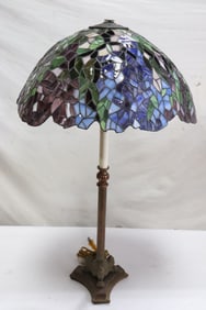 A fancy table lamp with leaded glass shade
