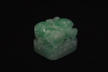 A finely carved apple green jadeite carved seal