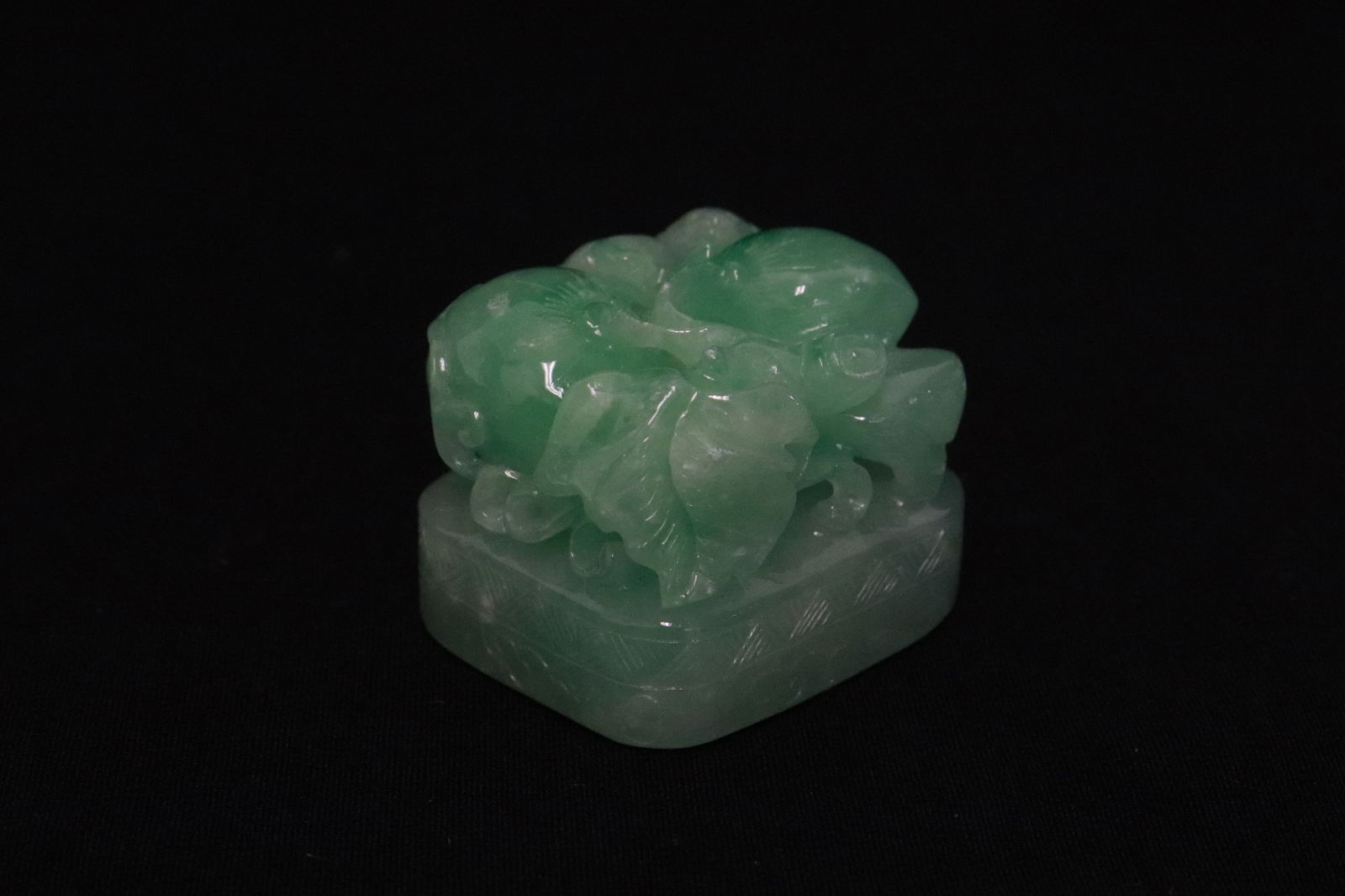 A finely carved apple green jadeite carved seal (1 of 7)