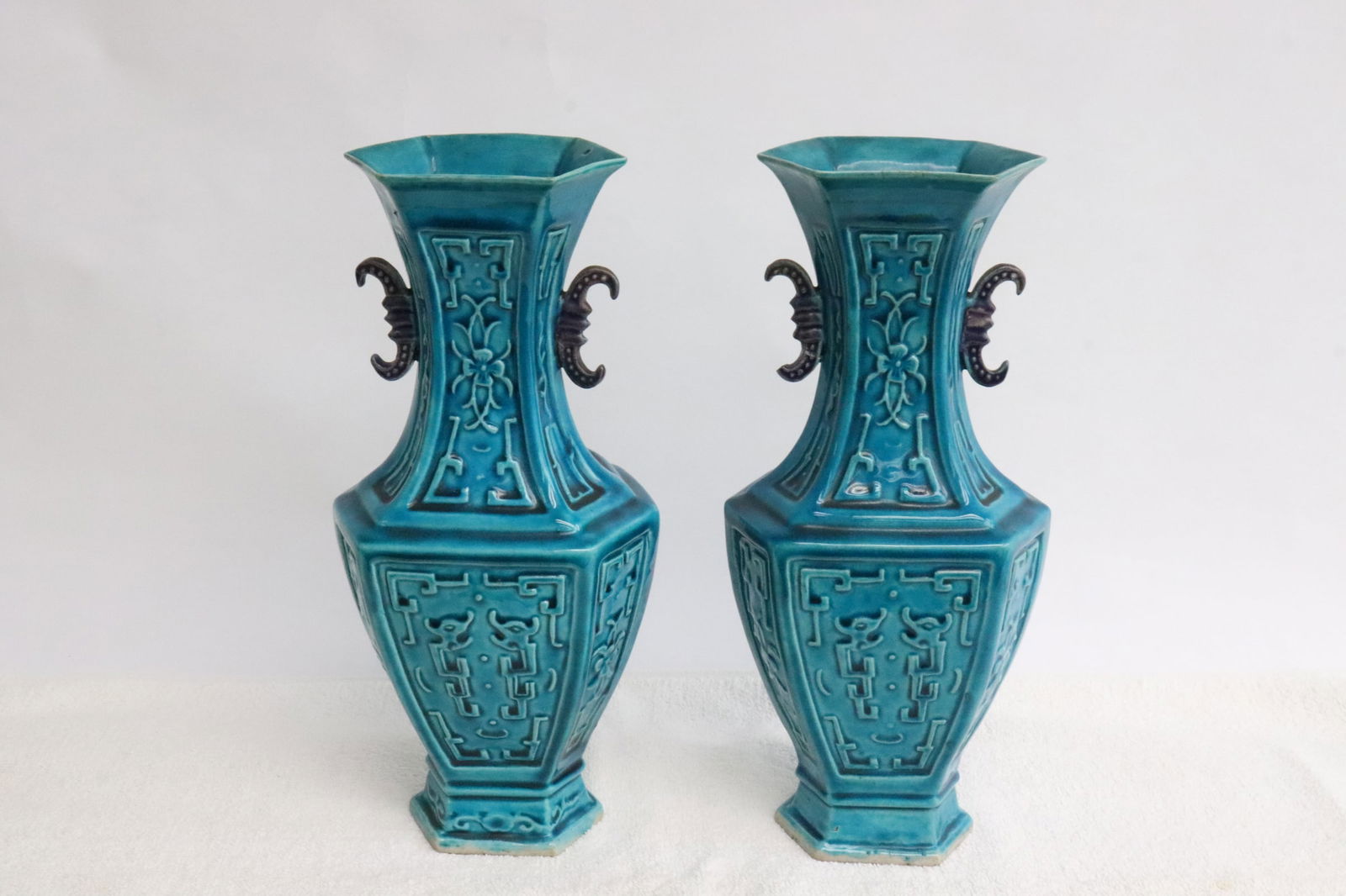 Pair Chinese 19th c. blue glazed porcelain vases: Pair Chinese 19th century blue glazed porcelain vases with archaic style motif decoration, 10"x3.35"x4.65"