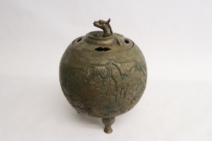 A round bronze covered censer