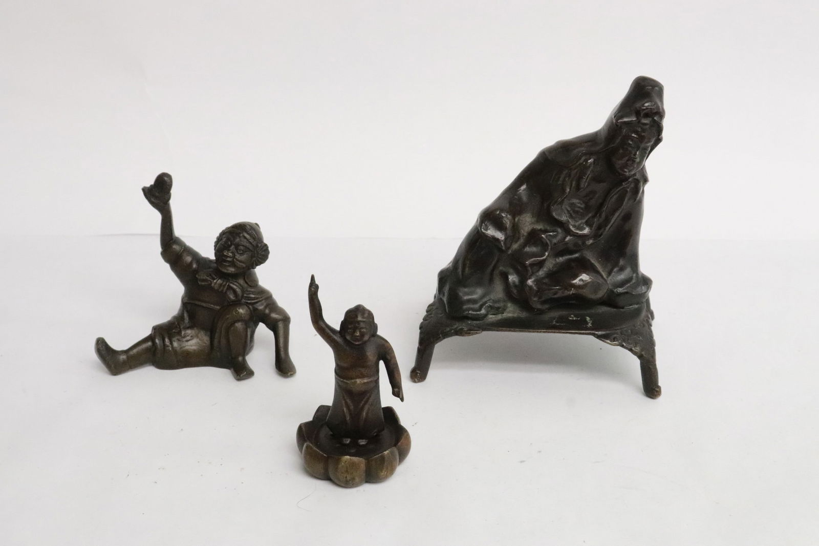 3 Chinese 19th/20th c. bronze sculpture of deity: 3 Chinese 19th/20th century bronze sculpture of deity, 2.7"H - 4.4"H