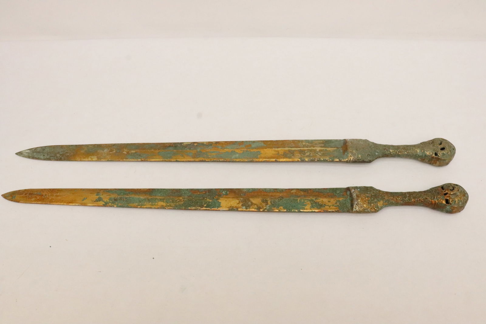 2 bronze swords: 2 bronze swords, 26.25"L, 26.65"L