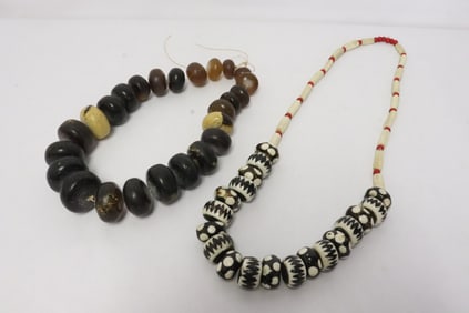amber like bead necklace, & a painted(?) bead necklace