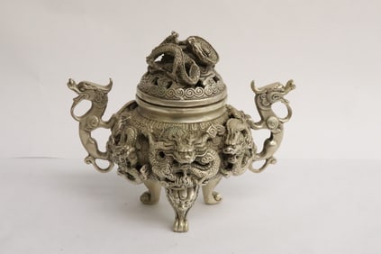 A very fancy white bronze covered censer