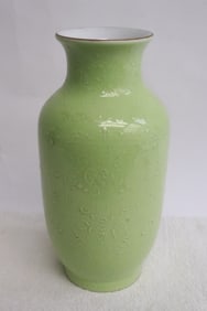 A green glazed porcelain vase