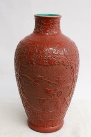 Chinese red glazed and carved porcelain vase