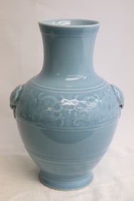 A sky blue porcelain handled vase