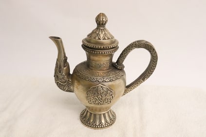 A white bronze teapot
