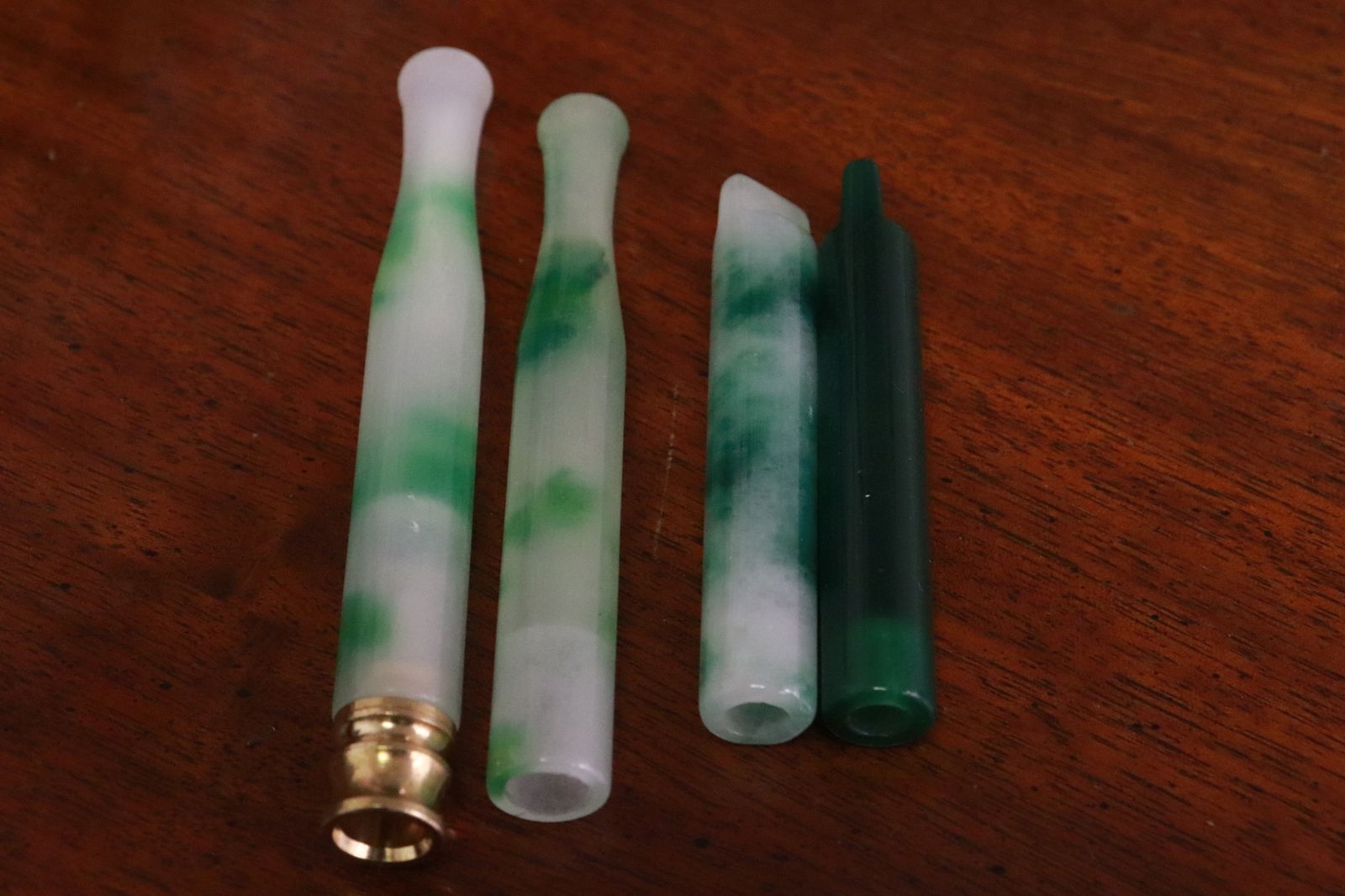 4 jadeite like cigarette holders (1 of 9)
