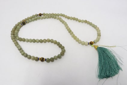 A jade like stone bead long necklace