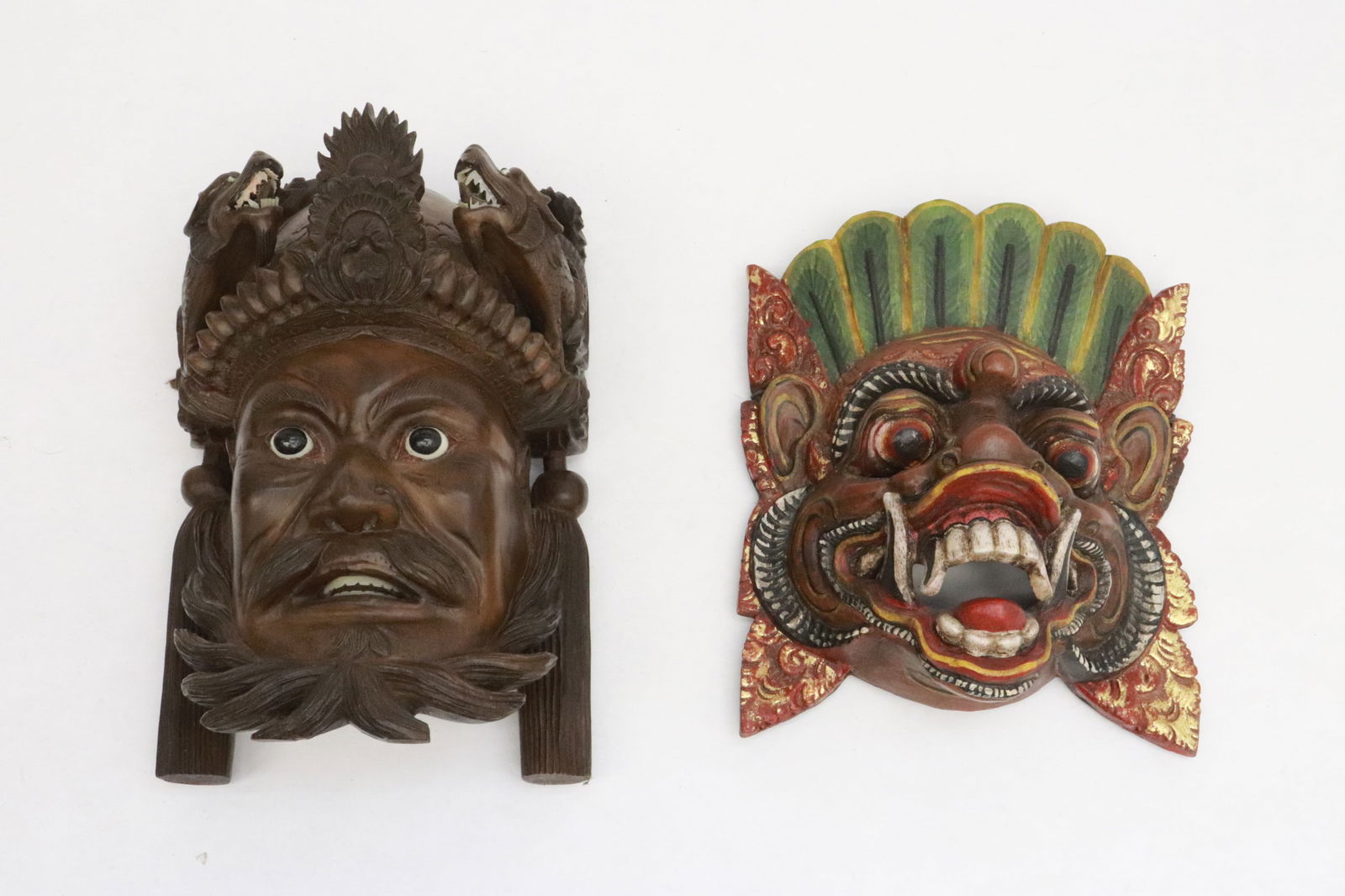 2 masks: 2 masks; a fine Chinese rosewood carved mask (10.2"x6.7"x4.7"), and a South Asian painted wood mask (9.5"x7.5"x4")
