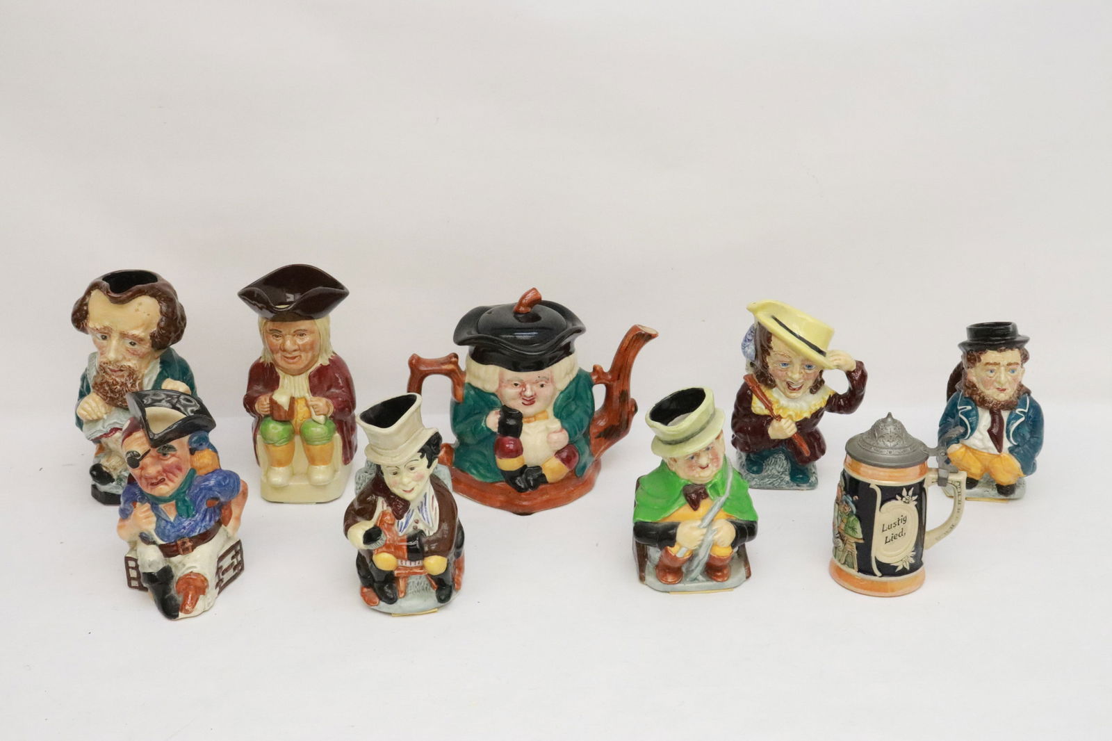 8 Royal Doulton style jugs, and a beer stein (1 of 12)