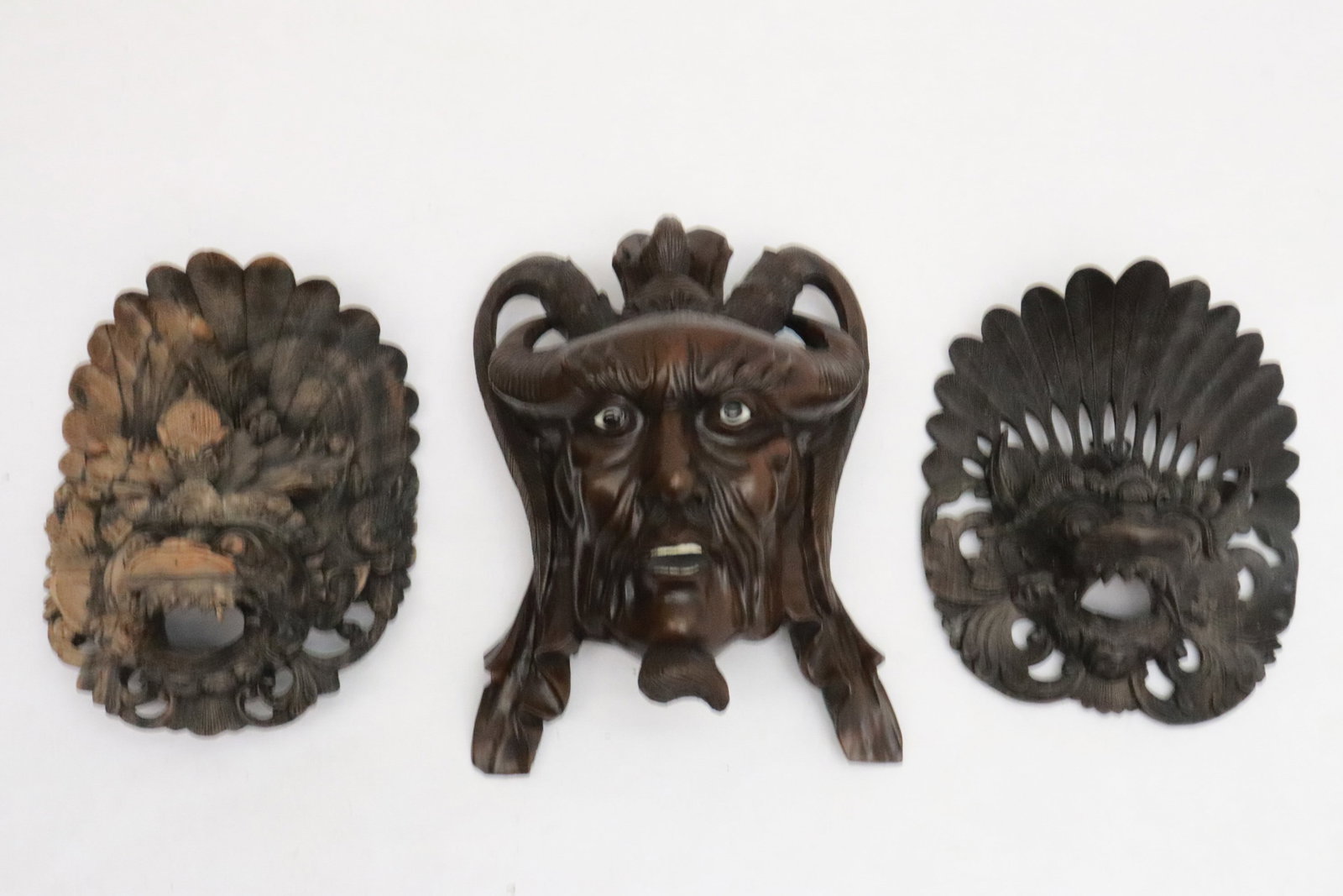 a rosewood mask, and 2 South Asian wood masks: 3 masks (8.1"x7.35"x2.85" - 10.3"x7.65"x4.7"); a rosewood mask, and 2 South Asian wood masks