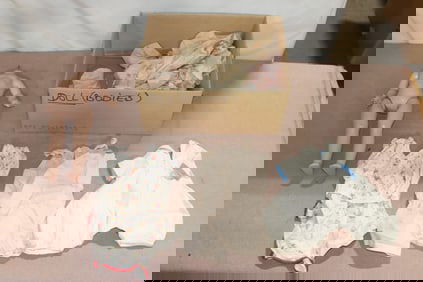 An old Shirley Temple/Raving beauty doll with multiple dresses