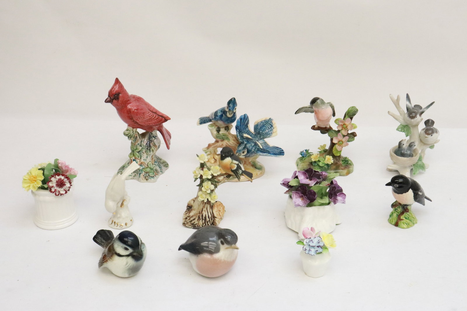 Lot of porcelain flowers and birds: Lot of porcelain flowers and birds; Royal Doulton, Goebel, etc., 2.35"H - 6.1"H