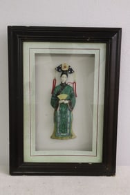 A painted Chinese figure display in shadow box