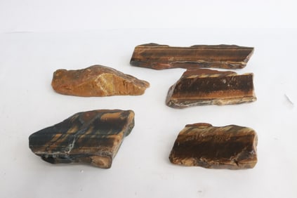 5 polished tiger eye stones