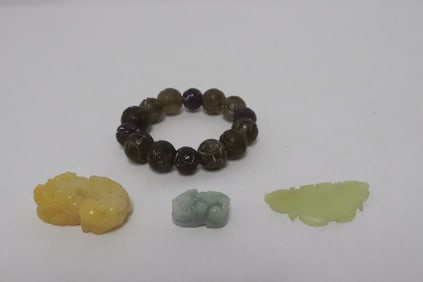 a carved crystal bracelet, & 3 jade carved ornaments