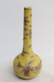 A purple on yellow porcelain vase