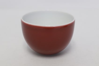A red glazed porcelain tea bowl