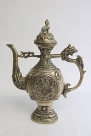 A white bronze wine server