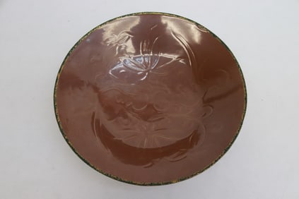 A brown glazed porcelain bowl