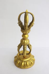 A rare Tibetan gilt bronze relic on stand