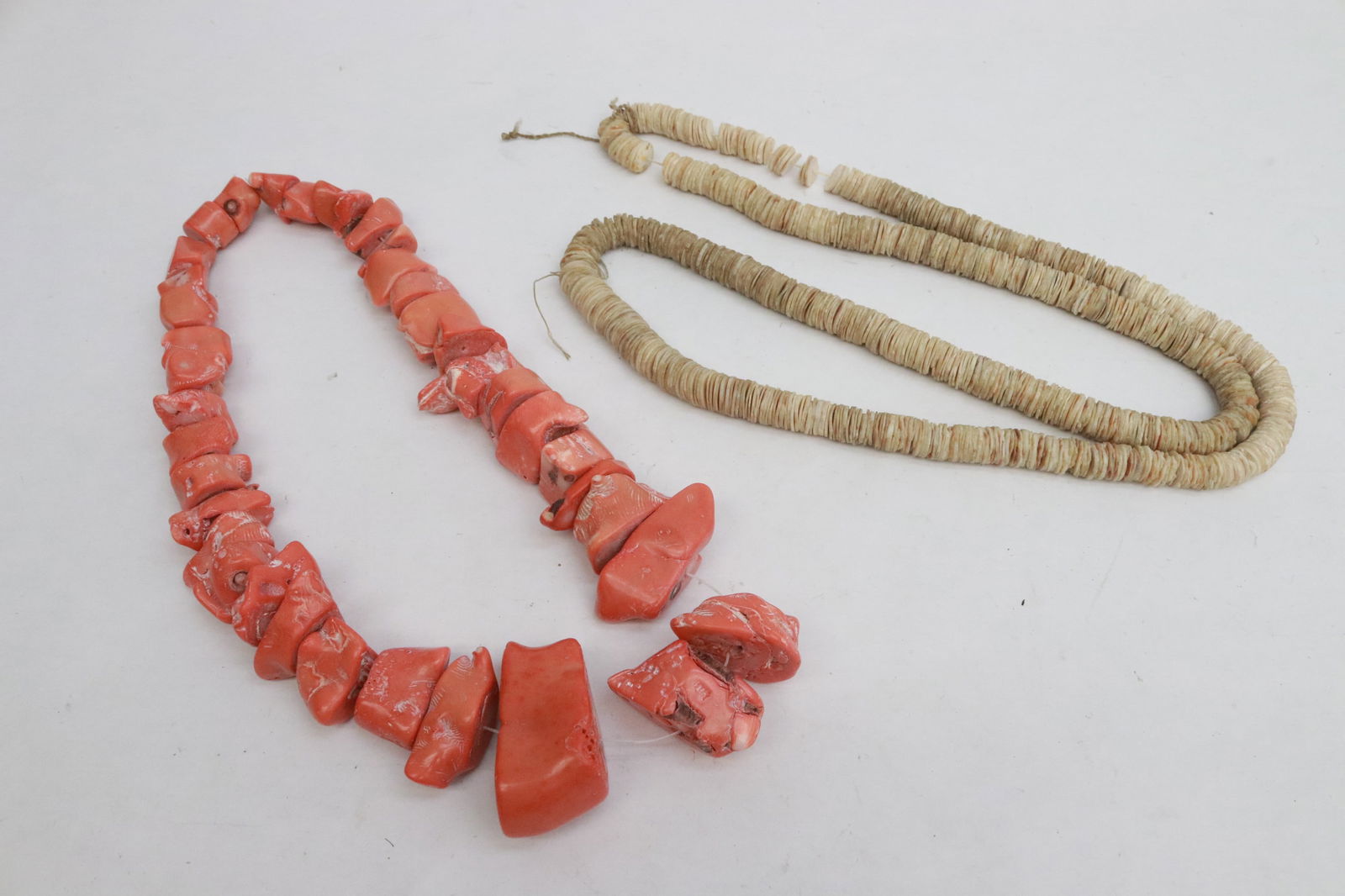 a coral bead necklace, and a shell bead necklace (1 of 9)