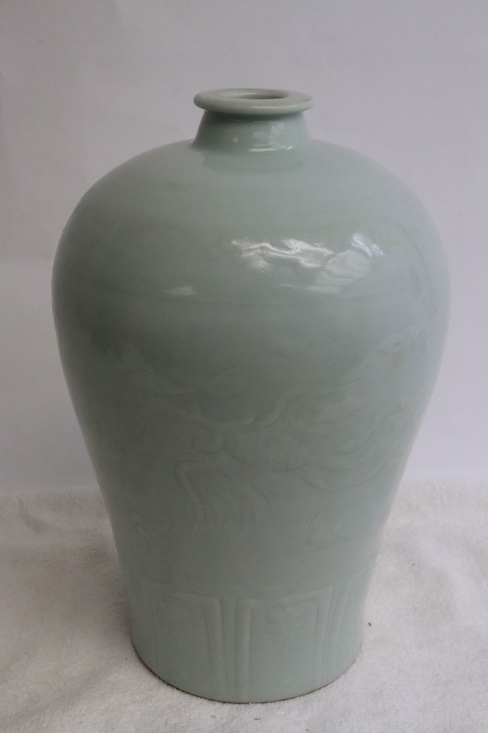 Light celadon meiping: Light celadon meiping embossed with phoenix motif decoration, 9.4"x6.3"dia