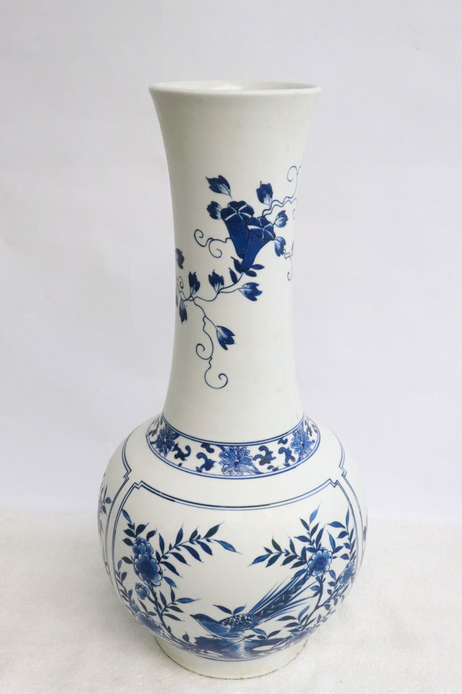 A blue and white porcelain vase: A blue and white porcelain vase, 16.65"x8.2"dia