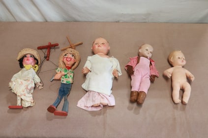 3 baby dolls, and 2 marionettes