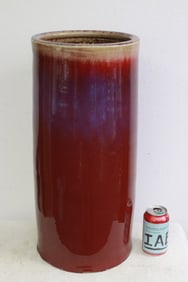 Large red glazed porcelain umbrella stand