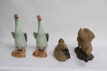 2 porcelain ducks, and 2 bisque sculpture of ducks
