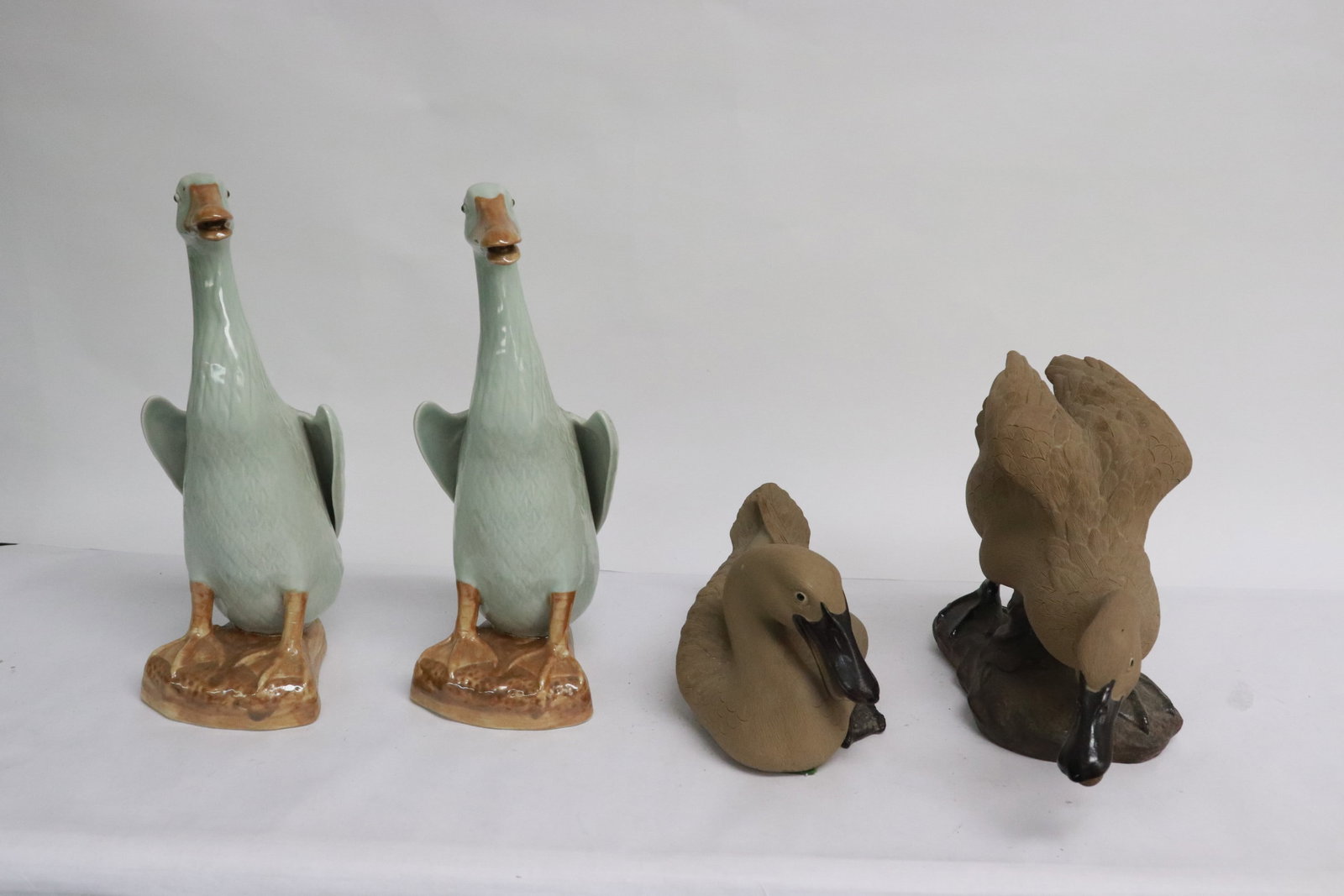 2 porcelain ducks, and 2 bisque sculpture of ducks: 4 pieces; 2 porcelain ducks (10.2"H ea), and 2 bisque sculpture of ducks (4.15"H, 6.7"H)