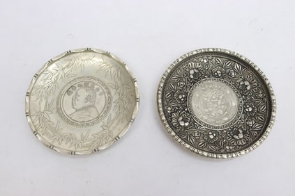 2 white bronze dishes