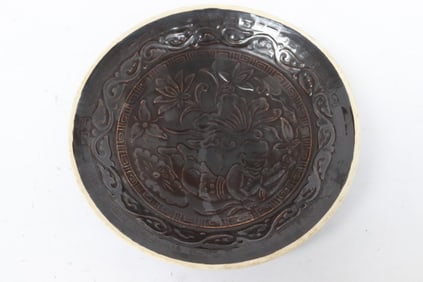 A brown glazed bowl
