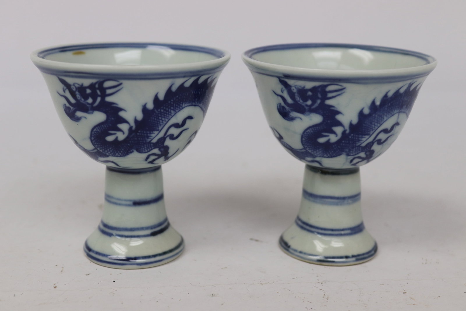 Pair Chinese blue and white porcelain stem cups: Pair Chinese blue and white porcelain stem cups, 3.4"x3.18"x3.18" ea