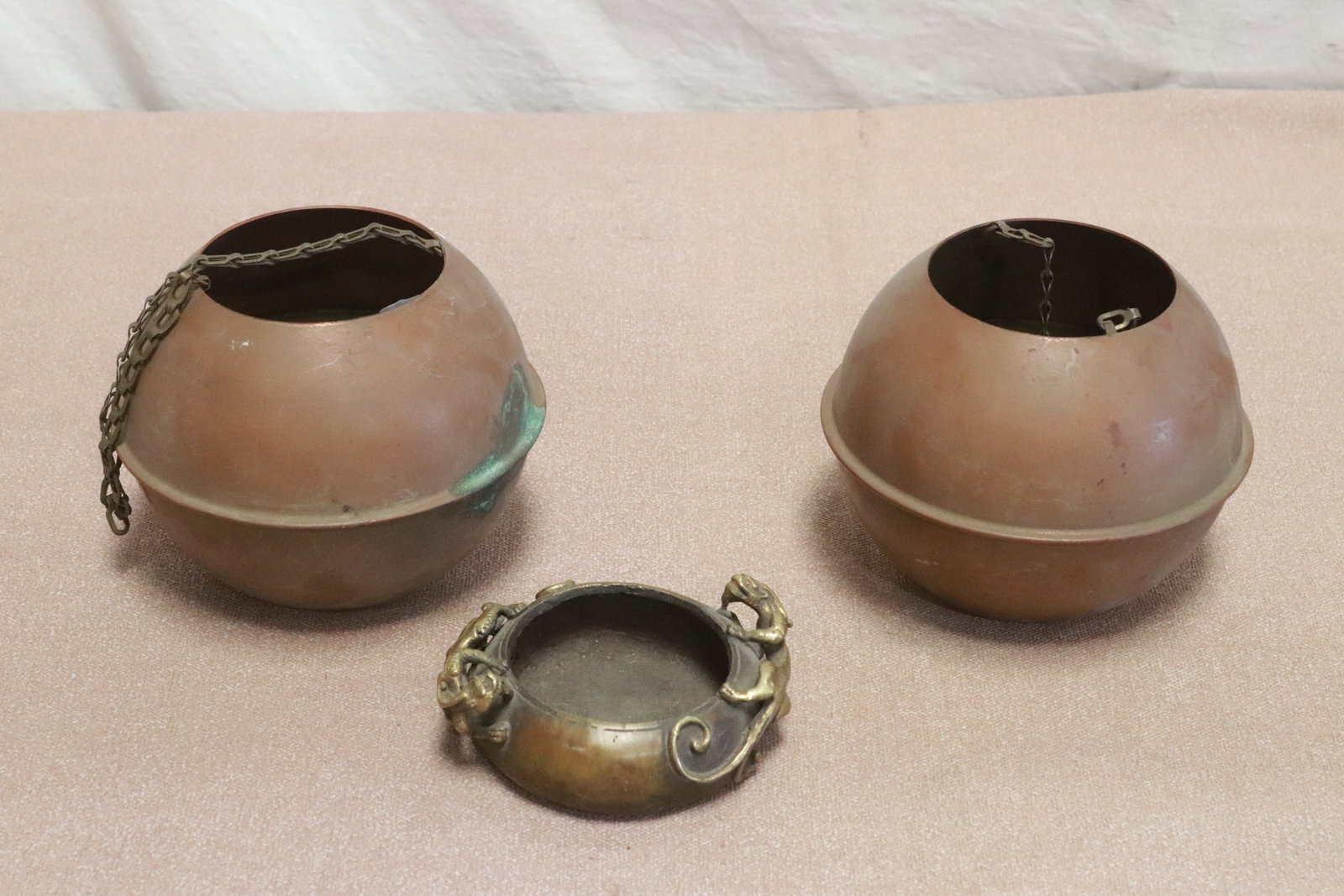 2 copper hanging censers, and a bronze censer: 3 pieces; 2 copper hanging censers (4.5"x5.5"dia ea), and a bronze censer with qilin motif decorated in high relief (1.65"x4.5"x3.75")