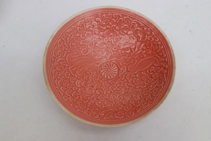 A pink glazed porcelain bowl