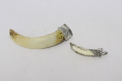 2 white metal decorated ornaments